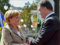 Poroshenko tells Merkel how Ukraine passes &quot;tragic test&quot;
