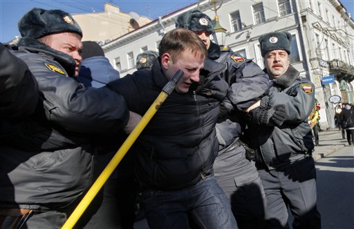 Police detain protesters in Moscow, St. Petersburg